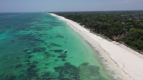  Diani beach landscape Kenyan coast African Sea drone aerial 4k waves blue indan ocean tropical mombasa turquoise white sand East Africa palms paradise view Wood boats on water