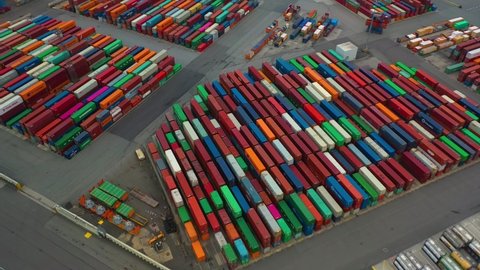 Drone shot of modern industrial port of Hamburg with containers from top view or aerial view. It is an import and export cargo port where is a part of shipping dock