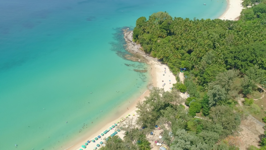 Amazing beautiful beach Aerial view of Tropical beach sea in the beautiful Phuket island Located at Surin beach Phuket Thailand on February 7-2022 | Shutterstock HD Video #1086599354
