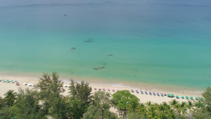Amazing beautiful beach Aerial view of Tropical beach sea in the beautiful Phuket island Located at Surin beach Phuket Thailand on February 7-2022 | Shutterstock HD Video #1086599366