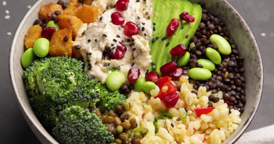 Buddha bowl, healthy and balanced food, vegan diet. Top view, closeup Royalty-Free Stock Footage #1086605261