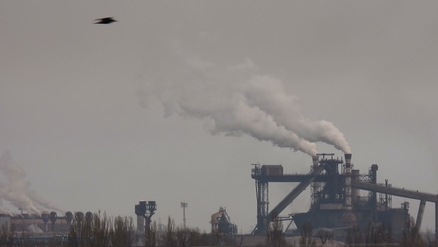 Global warming concept. The factory pollutes the air. Global warming concept. | Shutterstock HD Video #1086612338