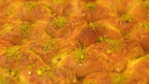 Traditional Middle Eastern dessert pistachio Baklava close-up in the local Baklava shop