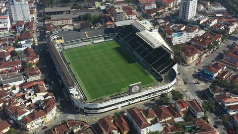 Panning wide of famous Urbano Caldeira Stadium at Coastal City of Santos state of Sao Paulo Brazil. Sports centre stadium field. Soccer field stadium aerial view.