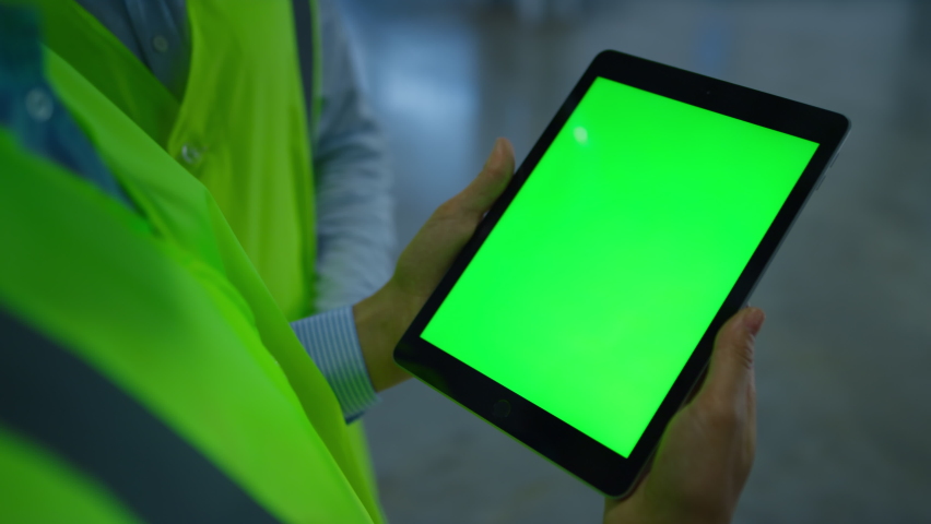 Green screen factory workers checking tablet information analysing production. Two unknown manufacture specialists examining device data inspecting shipment details. Technological workplace concept Royalty-Free Stock Footage #1086624575
