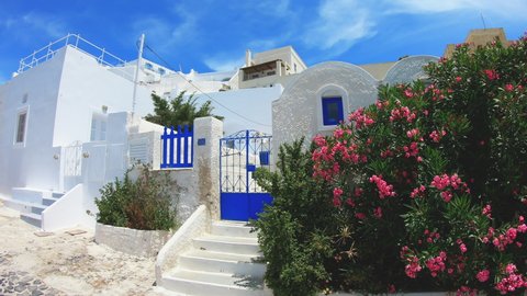 Bright blue old yard door on the island of Santorini, Greece, Europe. Traditional famous white Greek architecture.