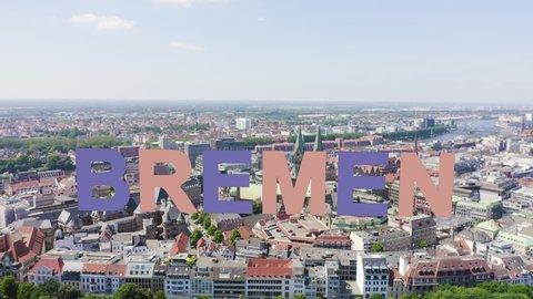 Inscription on video. Bremen, Germany. The historic part of Bremen, the old town. Bremen Cathedral ( St. Petri Dom Bremen ). View in flight. Multicolored text appears and disappears, Aerial View, Poi