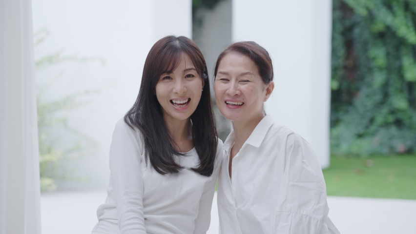 Smiling middle-aged Asian women in the room. Royalty-Free Stock Footage #1086650960