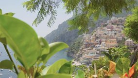 A panoramic view of the Positano on the Amalfi Coast, Italy. Sunny day, coastline, cliff, sea, boats, beautiful day, scenic, Italian architecture, gimbal camera move - 4K Video Footage