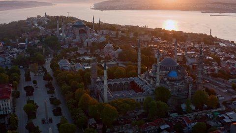 Stunning sunset long aerial shot of Blue Mosque and Hagia Sophia during the lockdown 