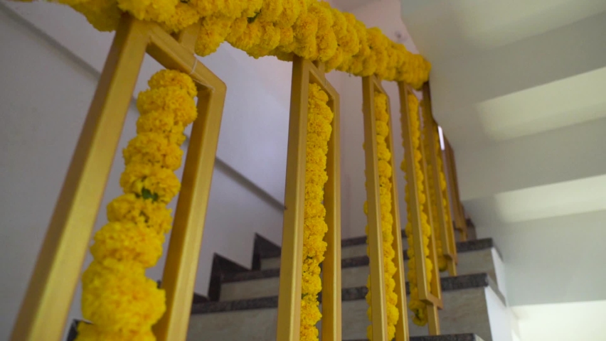Staircase decorated with marigold, indian traditional culture, festival decor at indian house. Royalty-Free Stock Footage #1086656162