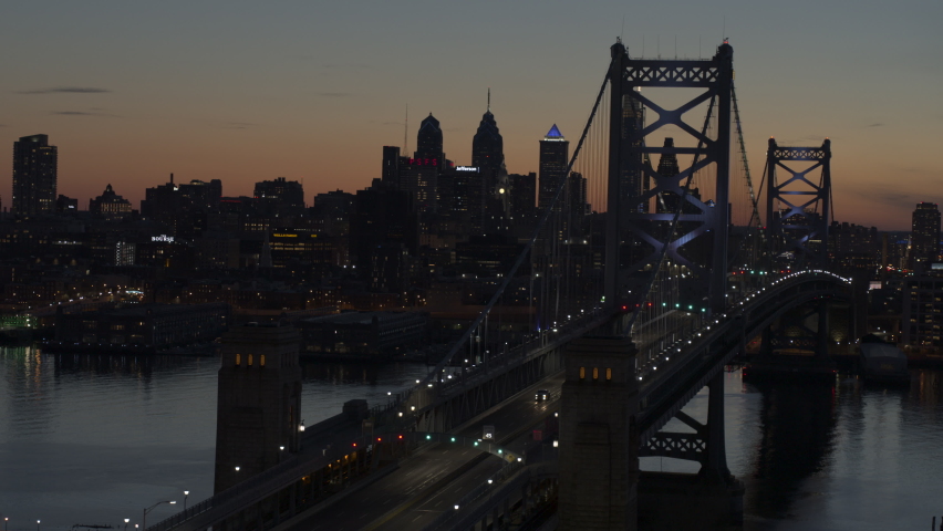 Beautiful drone video of the ben franklin bridge at sunset