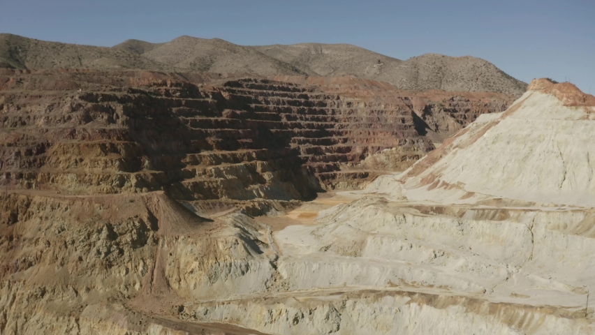Aerial flight over the Queen mine in Bisbee Arizona.  This is a very large open pit mine.