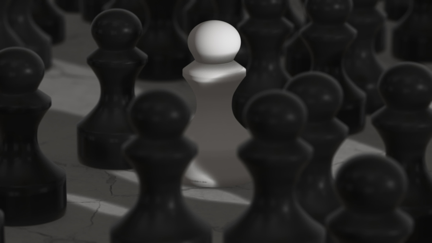 A single white pawn in a crowd of black pawns. Visualizes isolation, loneliness in an otherwise crowded surroundings.
Not fitting in, being a minority.