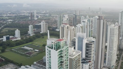 aerial view of roof top Panama City on a cloudy day, orbit close up