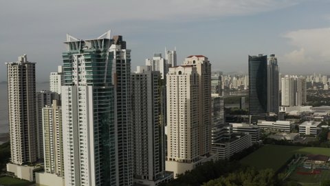 Aerial View of the tall buildings in Panama City on cloudy, pullback wide shot.