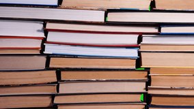 Lots of pile of books growing on green chroma key background. Teaching and learning science concept. A stack of books on a wooden table, stop motion, time laps. - Powered by Shutterstock - Get 15% off with code: PIKWIZARD15