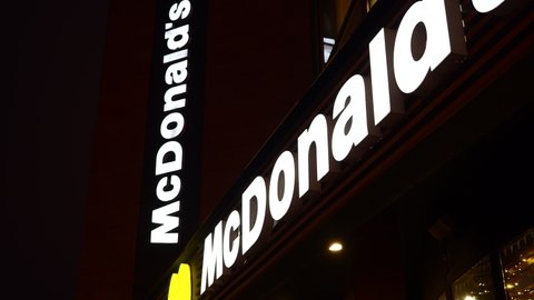 Belarus,Minsk,2022.McDonald's restaurant facade at night.
