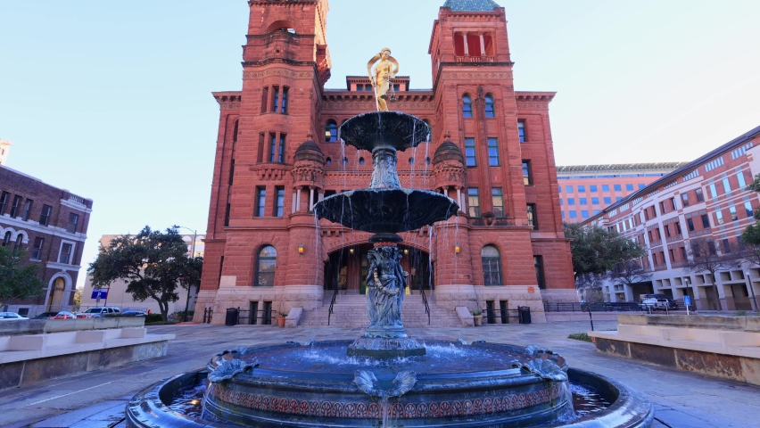 Sunny view of Courthouse building and Lady of Justice statue at Texas