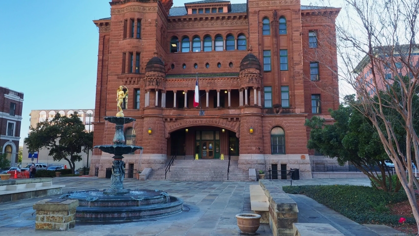 Sunny view of Courthouse building and Lady of Justice statue at Texas