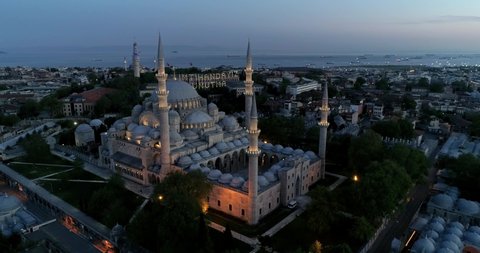 Stunning long aerial shot of Suleymaniye Mosque while sunset