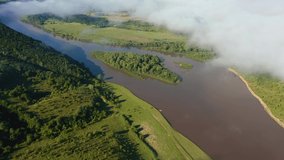 Shooting from a drone of thick fog over the riverbed. Bird's eye view. Location place Dniester canyon, Ukraine, Europe. Aerial footage, cinematic drone shot. Filmed UHD in 4k video. Beauty of earth.