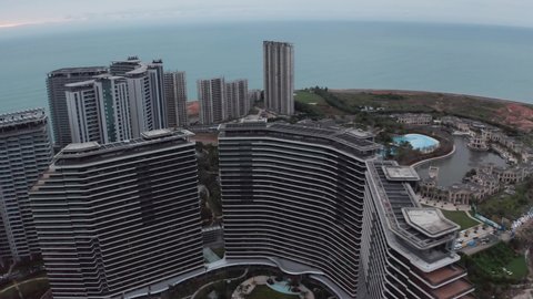 Sanya, Hainan, China - 02.05.2022: Aerial shot of hotel resort on artificial island.