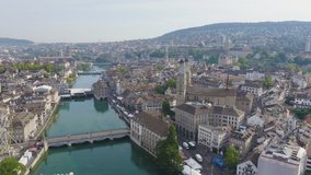 Inscription on video. Zurich, Switzerland. Panorama of the city from the air. Limmat River Flow Point, Kvaybrucke Bridge, Sechselautenplatz Square. Neon white effect text, Aerial View, Point of inter