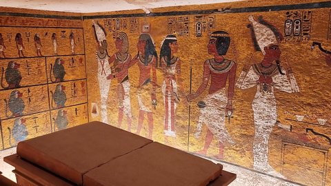 Luxor, Egypt - November 2021: Ancient Egyptian inscriptions and a tomb of Tutankhamen. The Valley of the King tomb KV62.