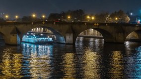 Lights and Shadows in Paris at Night on the Seine River Tourists Cruises Historic Bridge