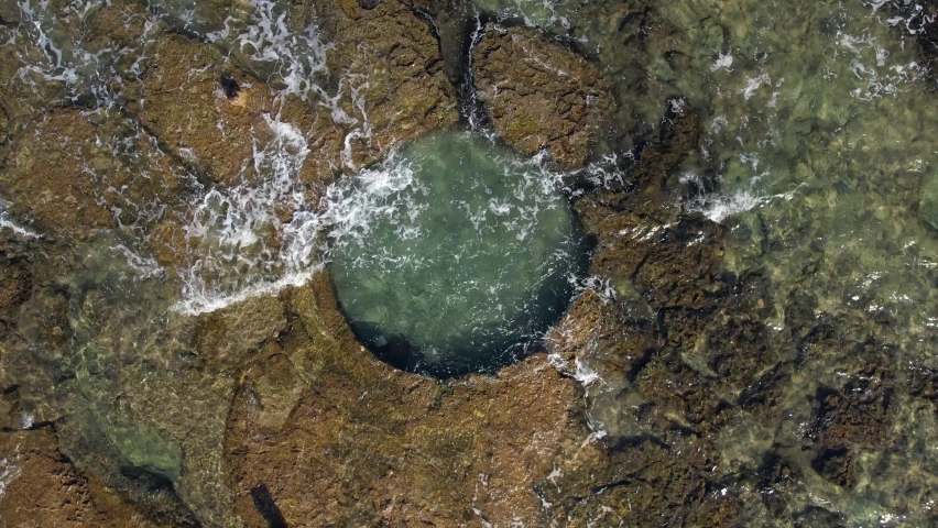 A natural pool is hewn in a natural rock near the shoreline of Haifa, Israel.