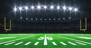 American football stadium with yellow goal posts on sides, grass field and glowing spotlights and camera flashes. Sport advertisement 4K video loop.