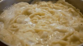 boiled dough, vareniks boiling. 4k video