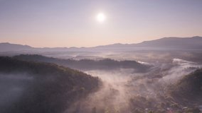 Hyper lapse video 4k motion, Aerial view Beautiful of morning scenery Golden light sunrise And the mist flows on high mountains. Pang Puai, Mae Moh, Lampang, Thailand.	