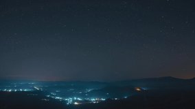 4K Time-Lapse Video motion of Beautiful Star Trails and space dust in the universe, long speed exposure over  Pang Puai, Mae Moh, Lampang, Thailand.	