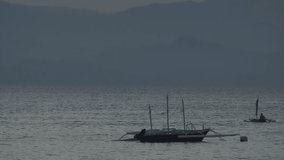 Philippine boat with bamboo wings is the oldest water transport on islands of Republic of Philippines.