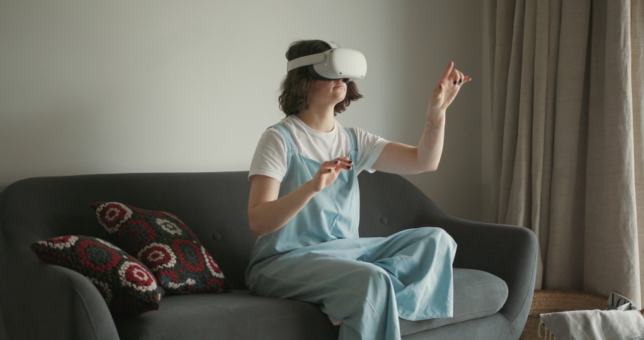 Woman exploring cyberspace with virtual reality headset | Shutterstock HD Video #1086714437