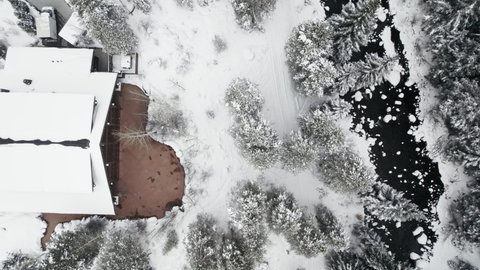 Donovan Pavilion Wedding Venue. Aerial Drone Footage Flying Over Venue Surrounded By Snow and Pine Trees in Vail Colorado USA During Winter.