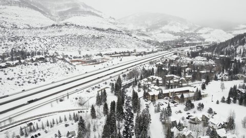 Aerial Drone Footage Flying Over Snow Covered Vail Colorado USA During Cold White Winter.