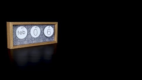 A wooden calendar block showing the date February 6th with a mans hand putting on and taking off the metal discs with the date and month on them, filmed in 8k quality 