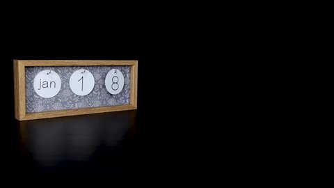 A wooden calendar block showing the date January 18th with a mans hand putting on and taking off the metal discs with the date and month on them, filmed in 8k quality 