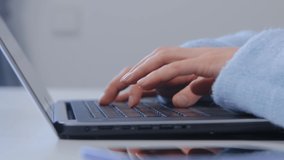 Business woman typing on laptop keyboard. Entrepreneur person working on notebook pc in closeup 4k footage. Hands of freelance writer female writing article on computer in stock video clip
