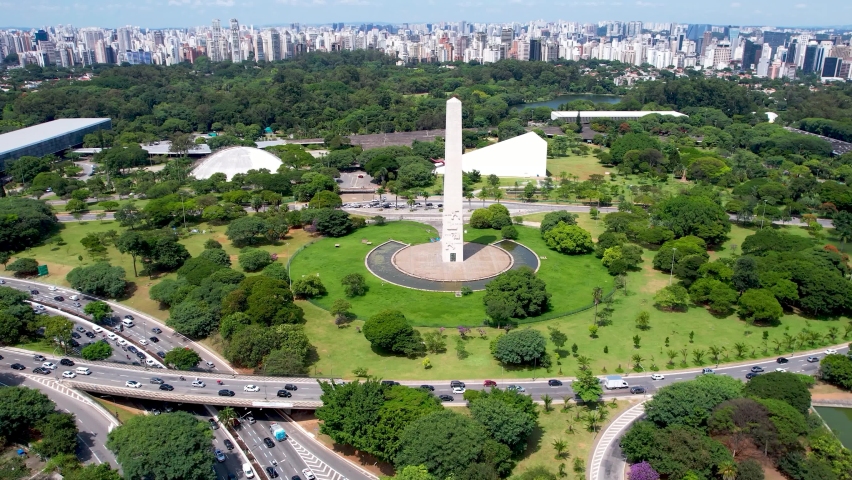Time lapse of Obelisk Monument near Ibirapuera park at downtown Sao Paulo Brazil. Stunning landscape of Ibirapuera park. Tropical scene of Ibirapuera neighborhood at downtown district.