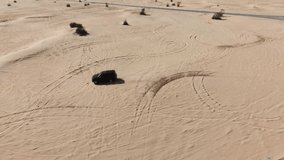 Slow Motion FPV Drone Clip of Off Road Car in the desert