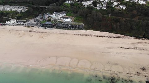 Aerial forward shot of Carbis Bay beach and Hotel in Cornwall England UK