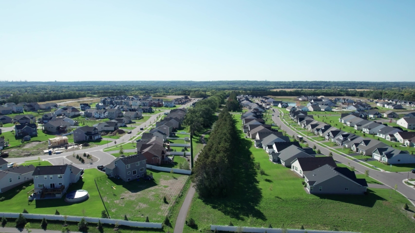 Aerial drone shot over top of a new development suburban community.
