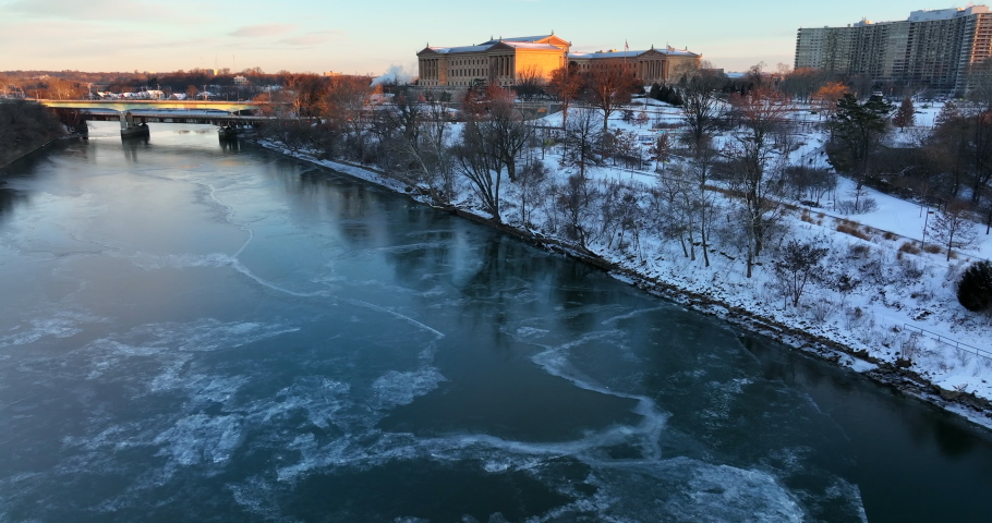 Frozen Schuylkill River and art museum. Winter snow scene in urban city park.