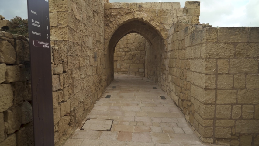 Walking in Cittadella Fortress near Arch and Walls made from Beautiful Sandy Limestone