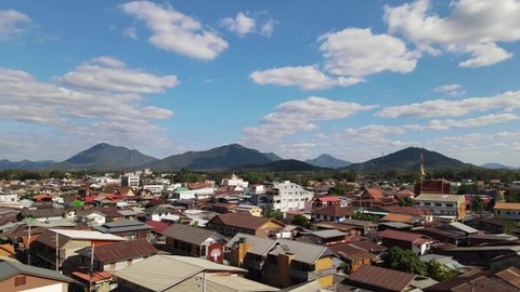 Aerial ascending footage of the rooftops of Chiang Khan where the famous Walking Street at the Mekong river is located, Loei in Thailand.