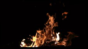 Spectacular shots of burning firewood in the grill. Flames and burning sparks close-up, fire patterns. Cinematic footage. Filmed in Full HD 1080p video. Slow motion clip 240 fps. Beauty of earth.